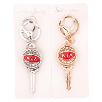 Ключодържател във формата на ключ с емблема на Kia, декориран с бели камъни