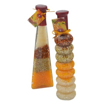 Сувенирна стъклена бутилка - различни цветни зърна