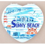 Сувенирно джобно огледало, декорирано с изглед на плажната ивица и хотели от Слънчев бряг и морски  мотиви